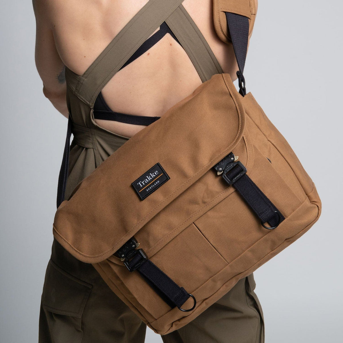 a woman with the bairn pro messenger on her back
