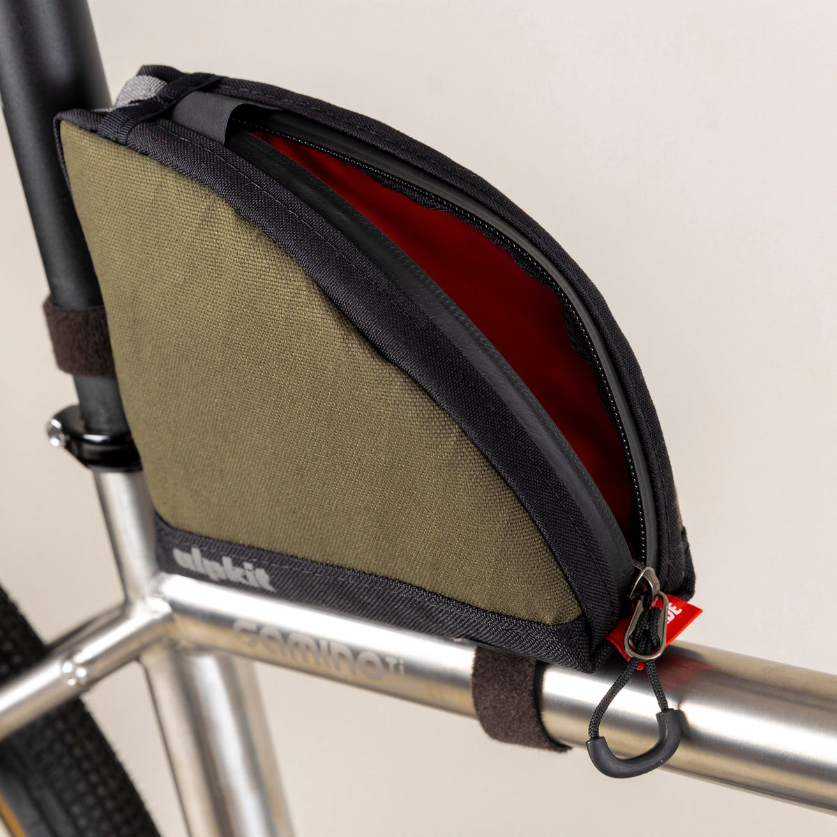alpkit fuel pod rear bikepacking bag in olive green open
