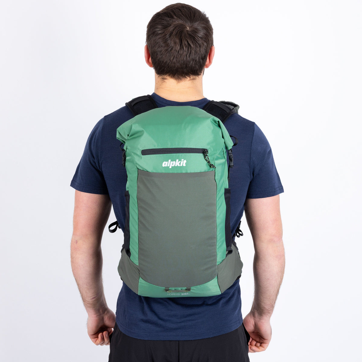 Person wearing a green and gray backpack