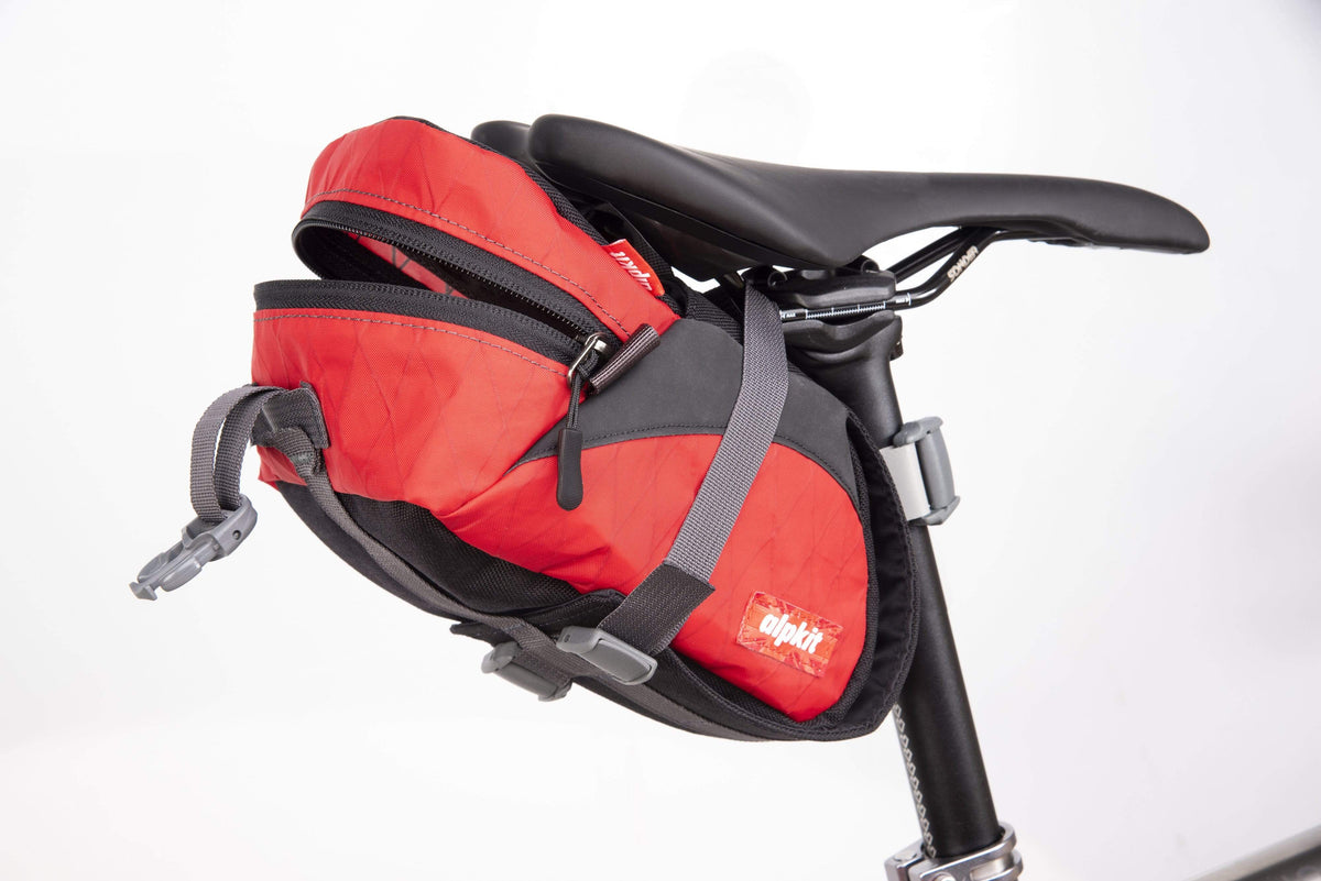 Alpkit enduro seatpack in chilli open - closed
