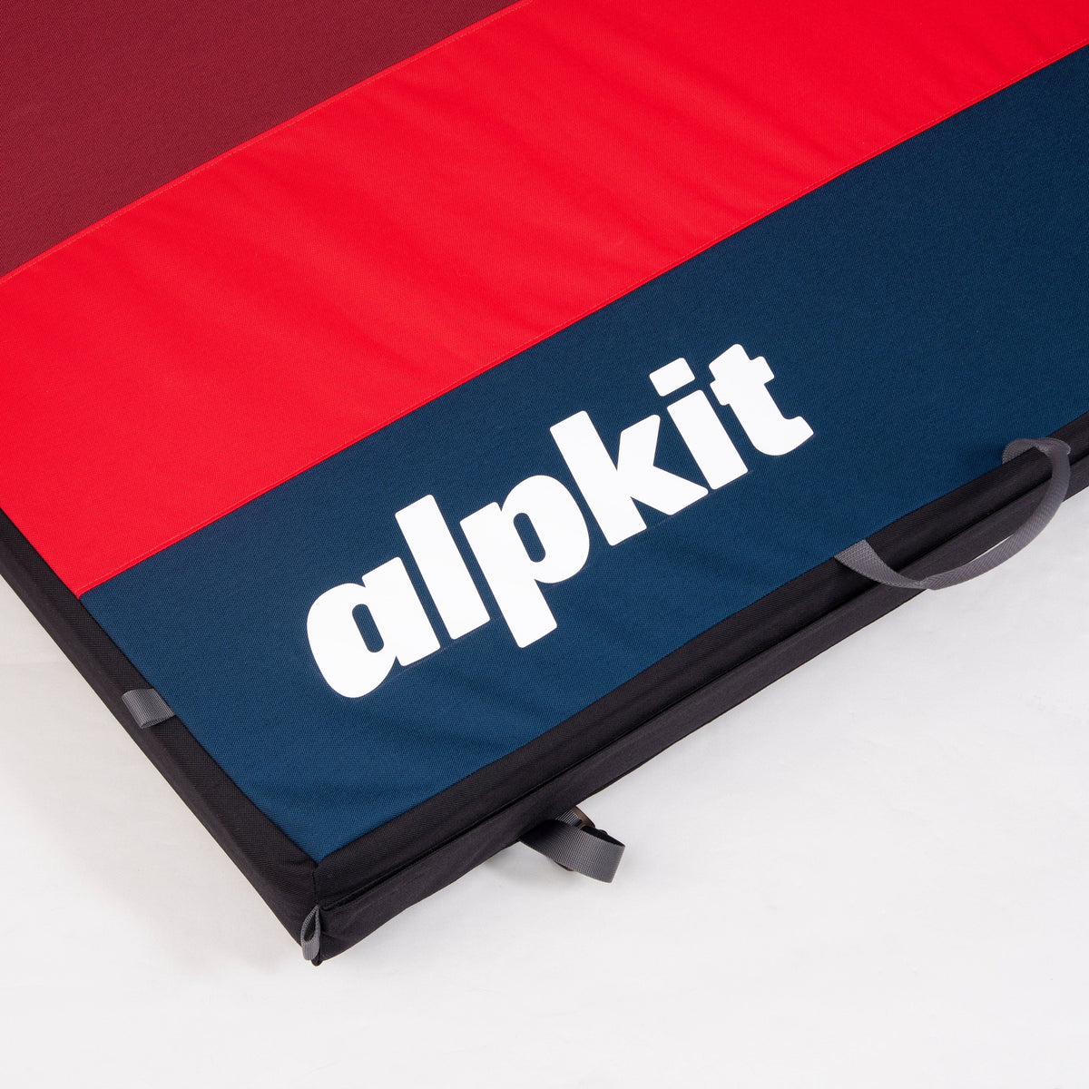 Alpkit Mujo hinged bouldering mat boulder pad printed logo