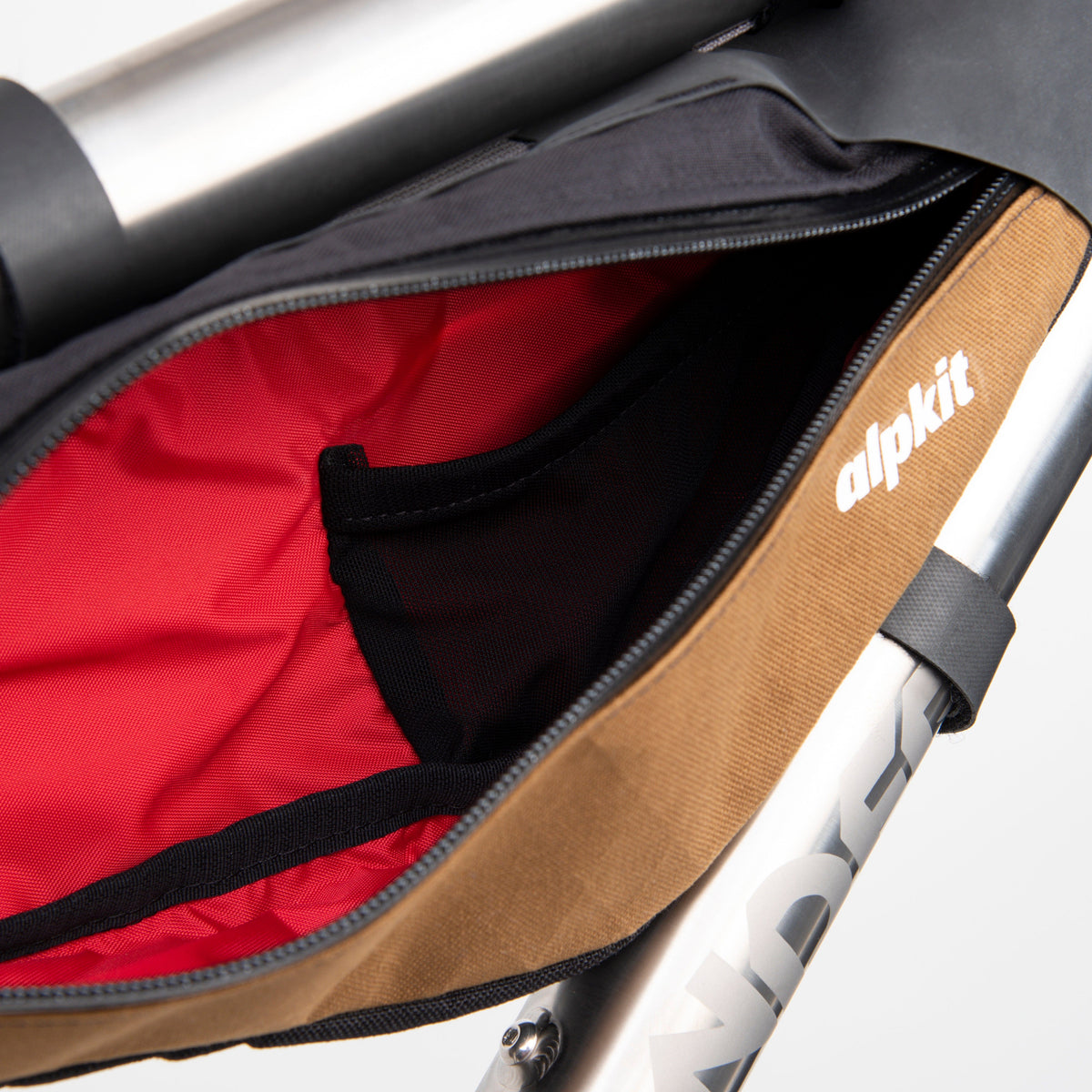 alpkit possum frame bag for bikepacking in mountain brownish pocket