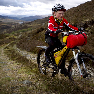 Female bikepackers in the Cairngorms