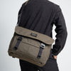 a person with an olive coloured Bairn Pro Messenger on their back