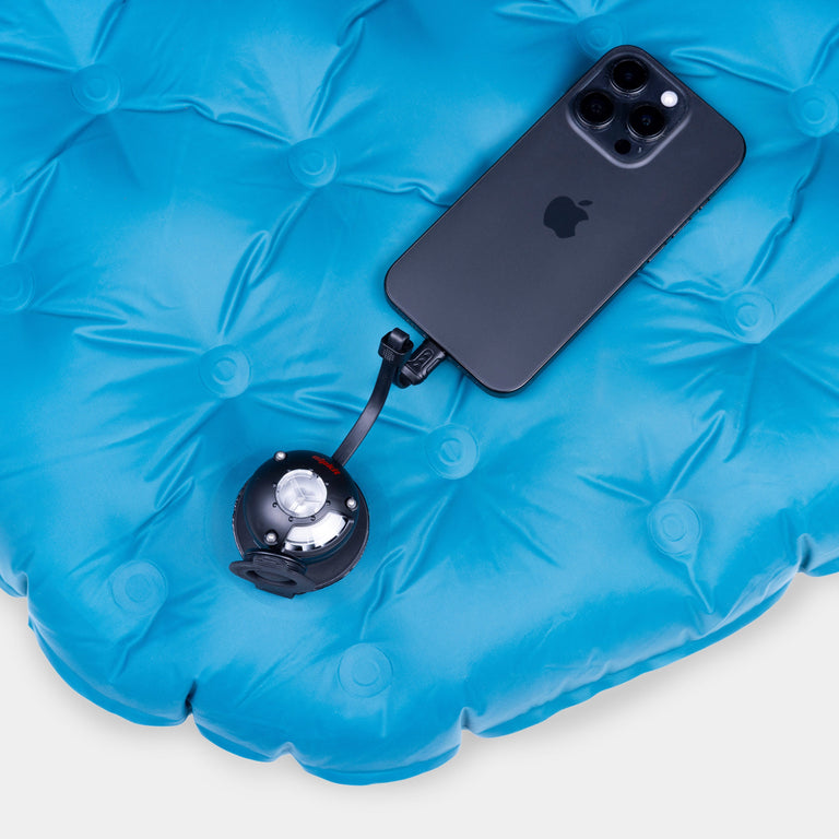 Micro Turbine Camping Mat Pump in use being powered by a mobile phone